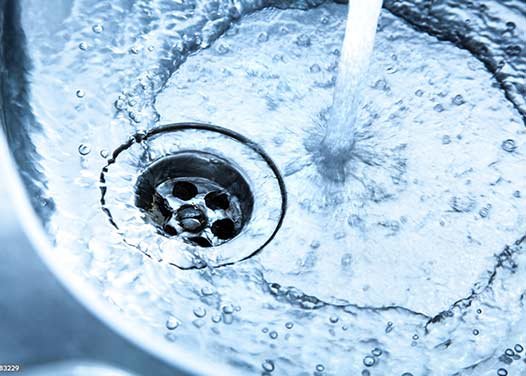 A sink with water running free and no blockages