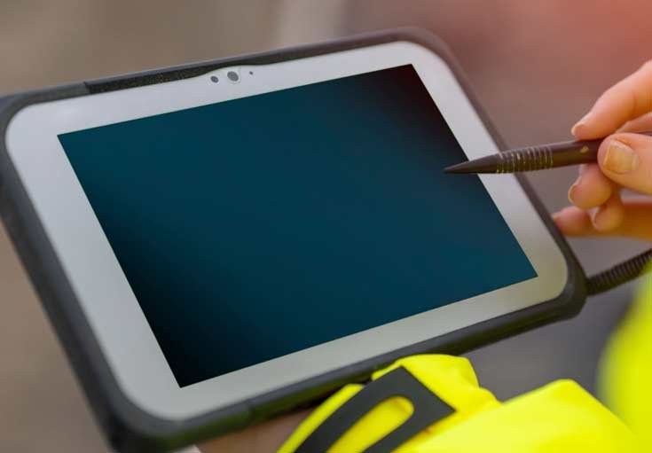 Drain Technician using a drain mapping monitor